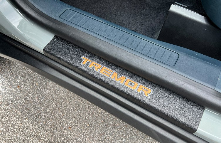 MAVERICK 2022-2027 DOOR SILL KIT TREMOR LOGO BY TUFSKINZ ON BLACK TEXTURE
